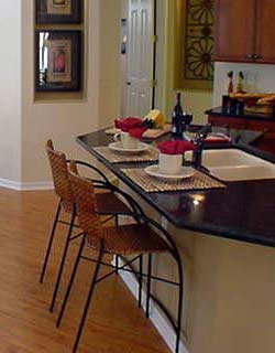Laminate wood flooring in dining and family rooms - Choice of Mica, granite, corian or silestone kitchen counter tops 